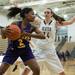 Ypsilanti's Ahjahana Browning is blocked by Dexter's Emma Kill after she makes a rebound during their game, Friday Jan. 11.
Courtney Sacco I AnnArbor.com 